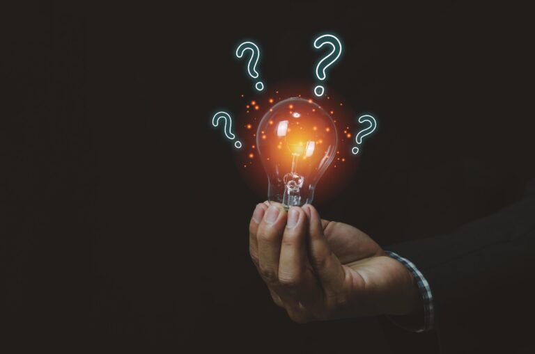 businessman holding a light bulb with question mark digital creative design concept technology marketing free photo 1