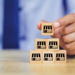 Home 1 businessman hand choose wood blog with franchise marketing