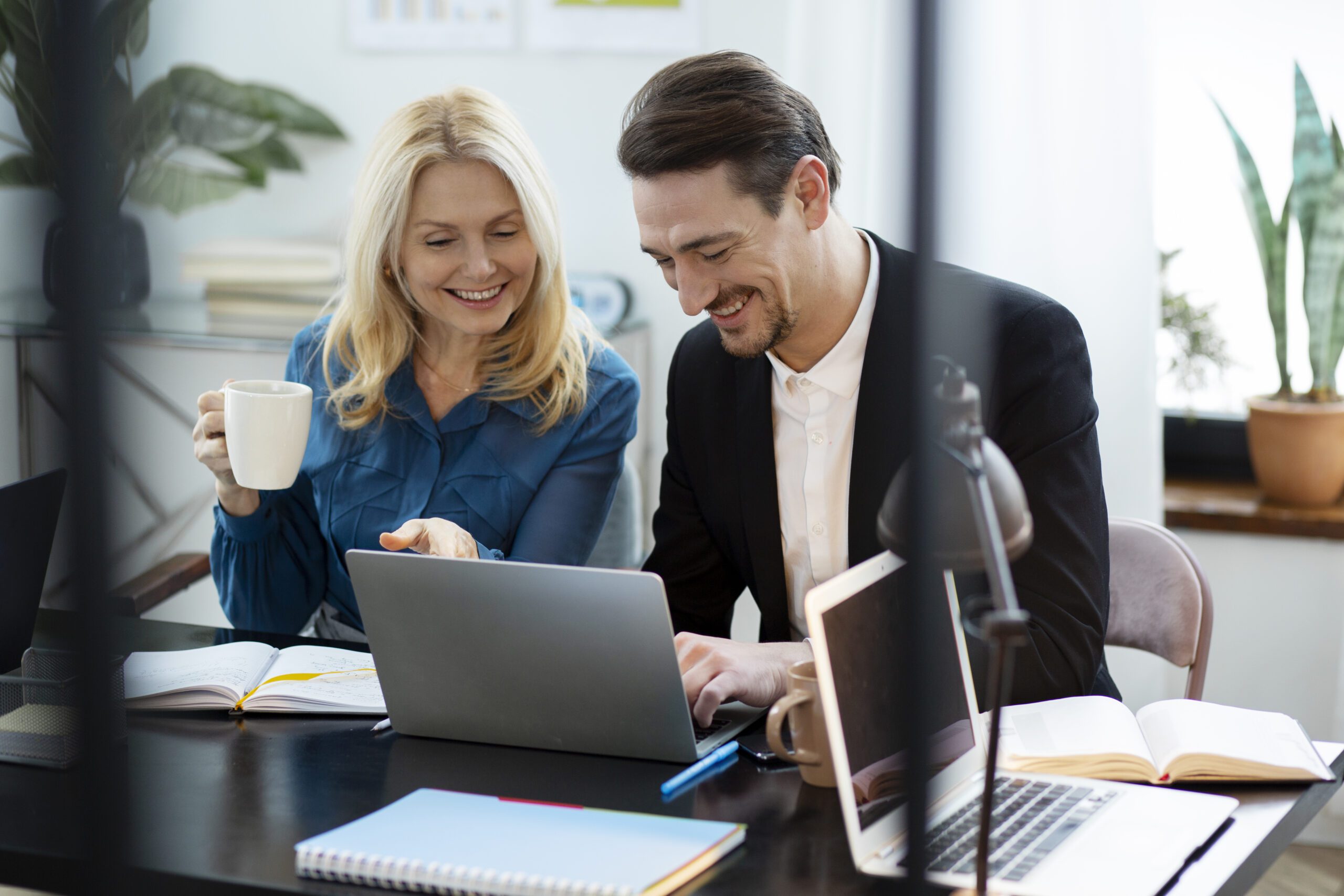 embark medium shot happy people working together 1 scaled